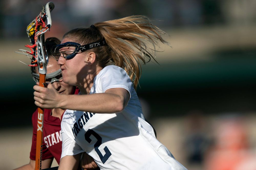 STANFORD, California - FEBRUARY 14:  Virginia Cavaliers midfield Sammy Mueller (2) is defended by Stanford Cardinal defense Kyra Pelton (8) during the first half at Cagan Stadium on February 14, 2020 in Stanford, California. The Virginia Cavaliers defeated the Stanford Cardinal 12-11. (Photo by Jason O. Watson)