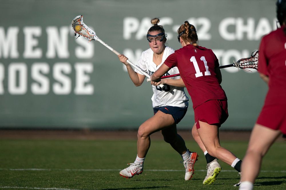 STANFORD, California - FEBRUARY 14: Virginia Cavaliers midfield Nora Bowen (28) is defended by Stanford Cardinal defense Maggie Bellaschi (11) during the second half at Cagan Stadium on February 14, 2020 in Stanford, California. The Virginia Cavaliers defeated the Stanford Cardinal 12-11. (Photo by Jason O. Watson)