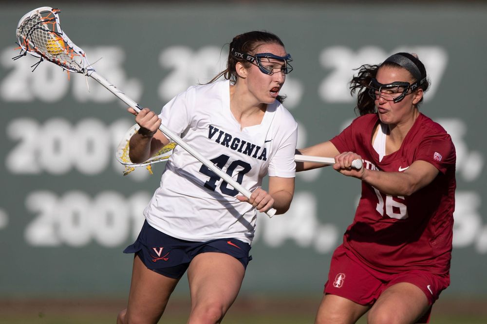 STANFORD, California - FEBRUARY 14:  Virginia Cavaliers attack Olivia Schildmeyer (40) is defended by Stanford Cardinal midfield Chelsea Trattner (16) during the first half at Cagan Stadium on February 14, 2020 in Stanford, California. The Virginia Cavaliers defeated the Stanford Cardinal 12-11. (Photo by Jason O. Watson)