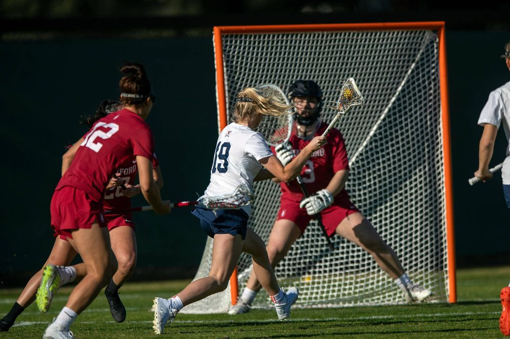 STANFORD, California - FEBRUARY 14:  Virginia Cavaliers midfield Annie Dyson (19) shoots against Stanford Cardinal goalkeeper Trudie Grattan (3) during the first half at Cagan Stadium on February 14, 2020 in Stanford, California. The Virginia Cavaliers defeated the Stanford Cardinal 12-11. (Photo by Jason O. Watson)
