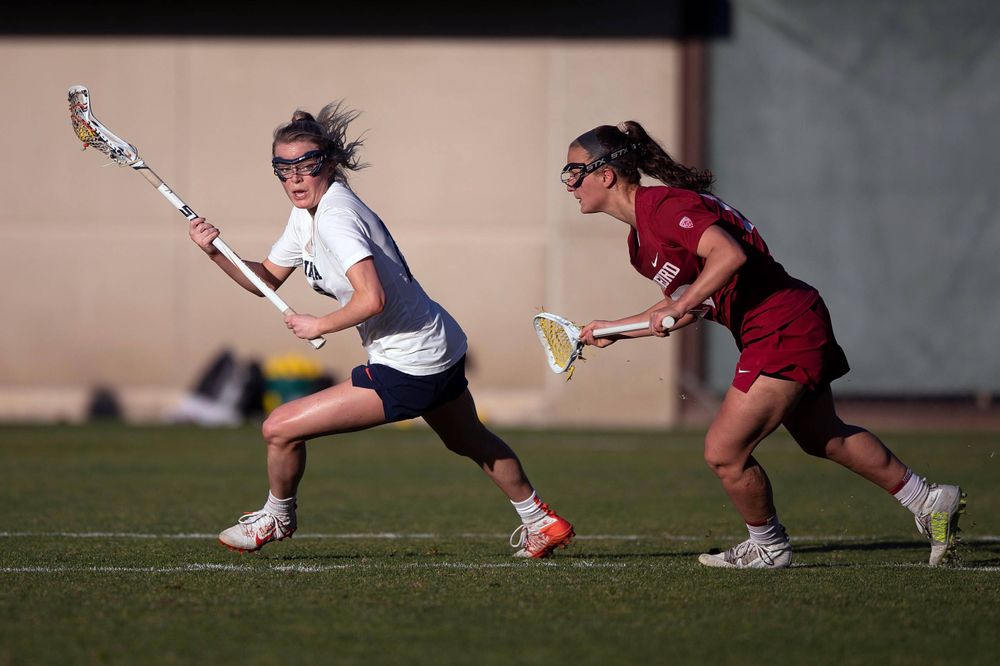 STANFORD, California - FEBRUARY 14:  Virginia Cavaliers midfield Courtlynne Caskin (25) is deafened by Stanford Cardinal defense Maggie Bellaschi (11) during the second half at Cagan Stadium on February 14, 2020 in Stanford, California. The Virginia Cavaliers defeated the Stanford Cardinal 12-11. (Photo by Jason O. Watson)