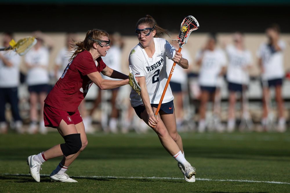 STANFORD, California - FEBRUARY 14:  Virginia Cavaliers midfield Sammy Mueller (2) is defended by Stanford Cardinal midfield Jacie Lemos (33) during the first half at Cagan Stadium on February 14, 2020 in Stanford, California. The Virginia Cavaliers defeated the Stanford Cardinal 12-11. (Photo by Jason O. Watson)