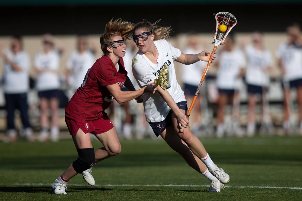 STANFORD, California - FEBRUARY 14:  Virginia Cavaliers midfield Sammy Mueller (2) is defended by Stanford Cardinal midfield Jacie Lemos (33) during the first half at Cagan Stadium on February 14, 2020 in Stanford, California. The Virginia Cavaliers defeated the Stanford Cardinal 12-11. (Photo by Jason O. Watson)
