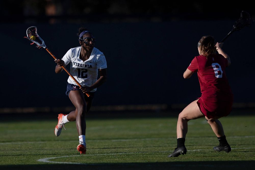 STANFORD, California - FEBRUARY 14:  Virginia Cavaliers defense Jalen Knight (12) runs up field past Stanford Cardinal defense Kyra Pelton (8) during the second half at Cagan Stadium on February 14, 2020 in Stanford, California. The Virginia Cavaliers defeated the Stanford Cardinal 12-11. (Photo by Jason O. Watson)