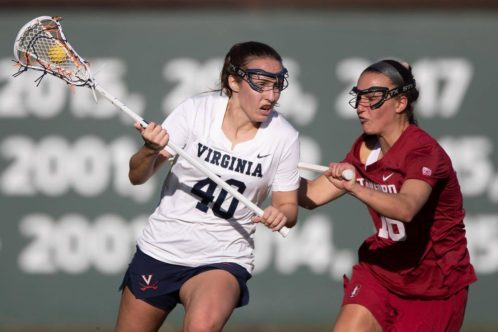 STANFORD, California - FEBRUARY 14:  Virginia Cavaliers attack Olivia Schildmeyer (40) is defended by Stanford Cardinal midfield Chelsea Trattner (16) during the first half at Cagan Stadium on February 14, 2020 in Stanford, California. The Virginia Cavaliers defeated the Stanford Cardinal 12-11. (Photo by Jason O. Watson)