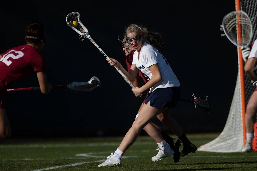 STANFORD, California - FEBRUARY 14:  Virginia Cavaliers midfield Annie Dyson (19) holds the ball during the first half against the Stanford Cardinal at Cagan Stadium on February 14, 2020 in Stanford, California. The Virginia Cavaliers defeated the Stanford Cardinal 12-11. (Photo by Jason O. Watson)